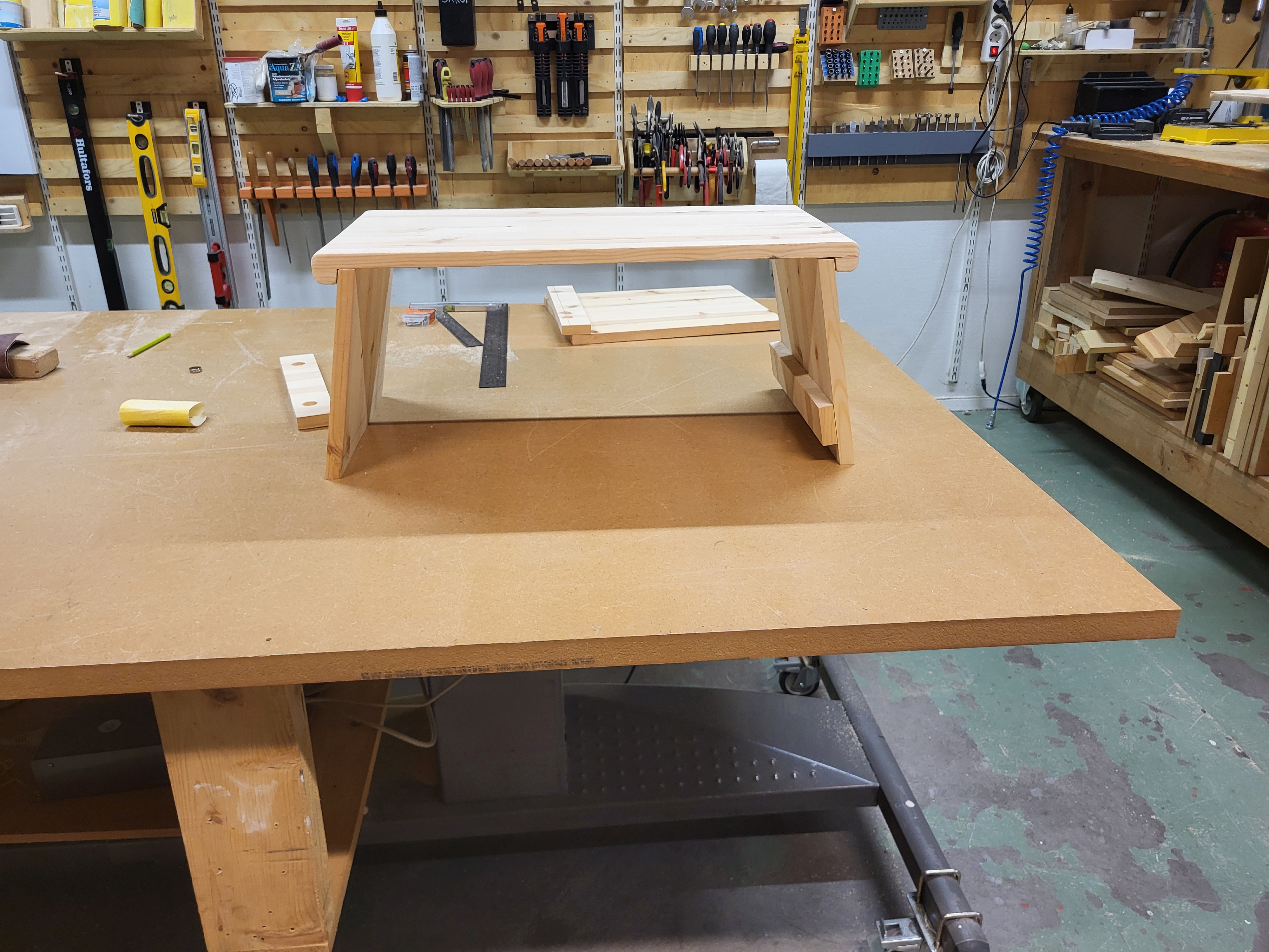 Testing table height with floor cushions